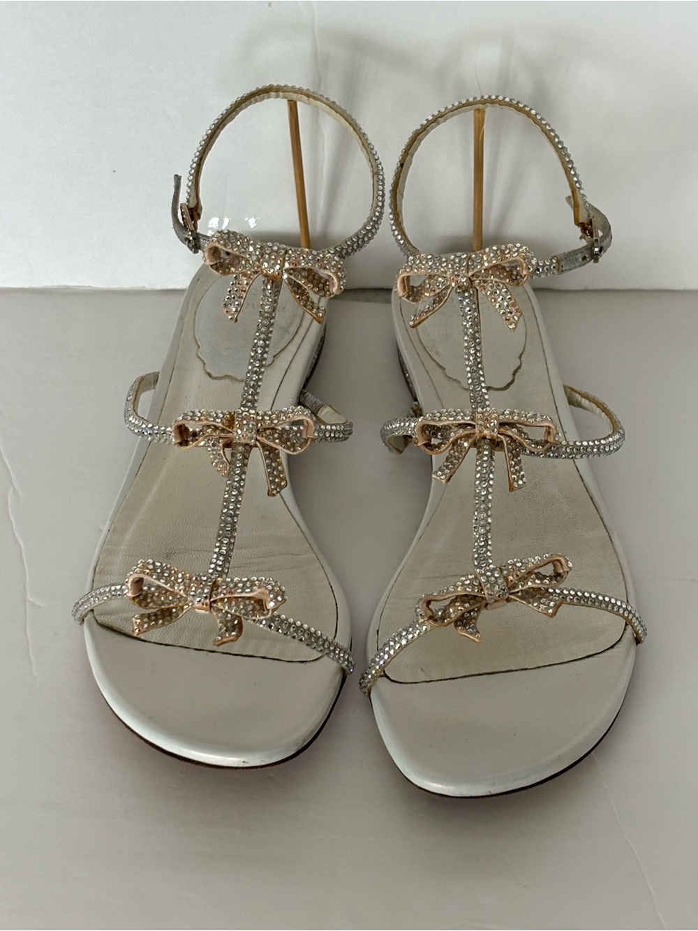 Rene Caovilla Silver Sandals with Gold Bow Embellishments